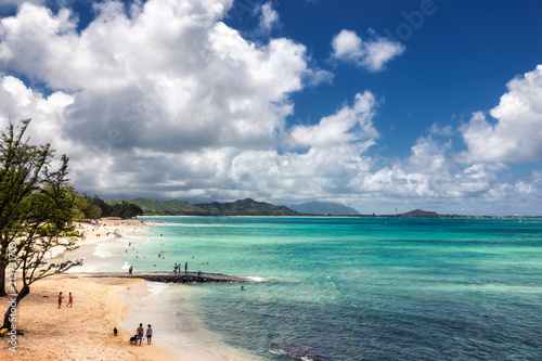 View of Kailua beach with lots of people sunbathing and swimming photo