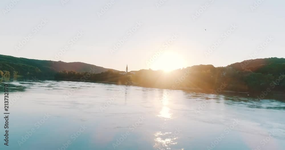 Beatiful Sunset over Danube river with Village in background Beatiful Sunset over Danube river with Village in background
