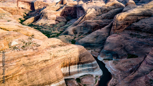 Aerial view of Lake Powell near Navjo Mountain, San Juan River in Glen Canyon with colorful buttes, skies and water