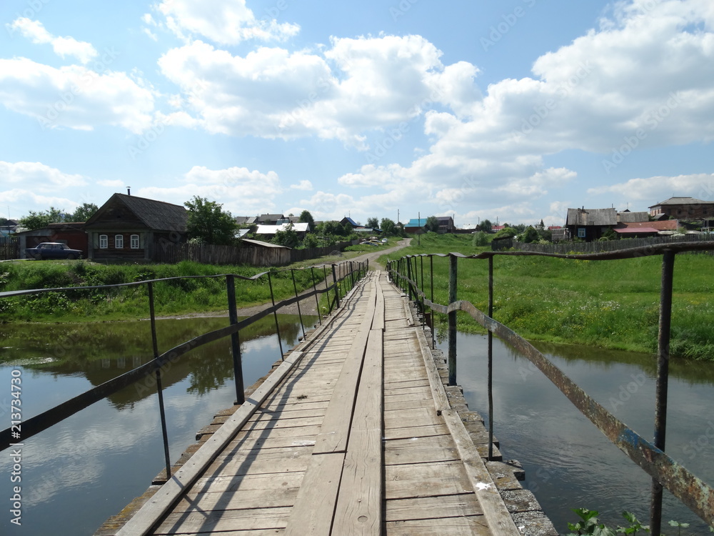 Suspension bridge over the Utka river, Novoutkinsk village, Sverdlovskaya oblast, Russia
