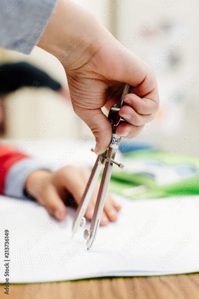 student using compass in math class Stock Photo Adobe Stock