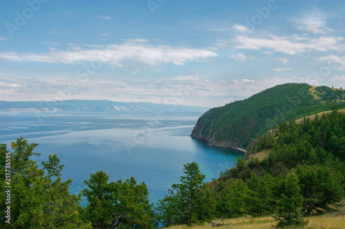 Beautiful view on green cape and water space of lake Baikal  scenic water landscape