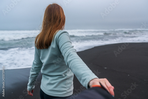 a woman leads her boyfriend on Kamchatka