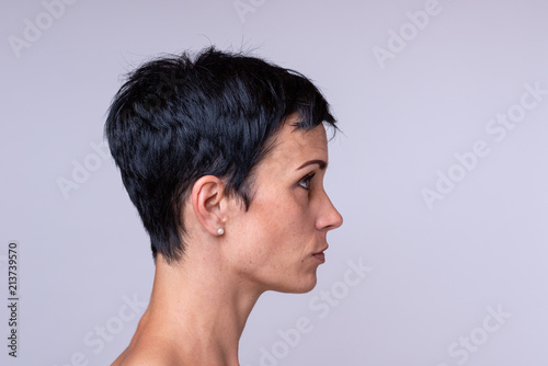 Portrait of a woman over neutral background