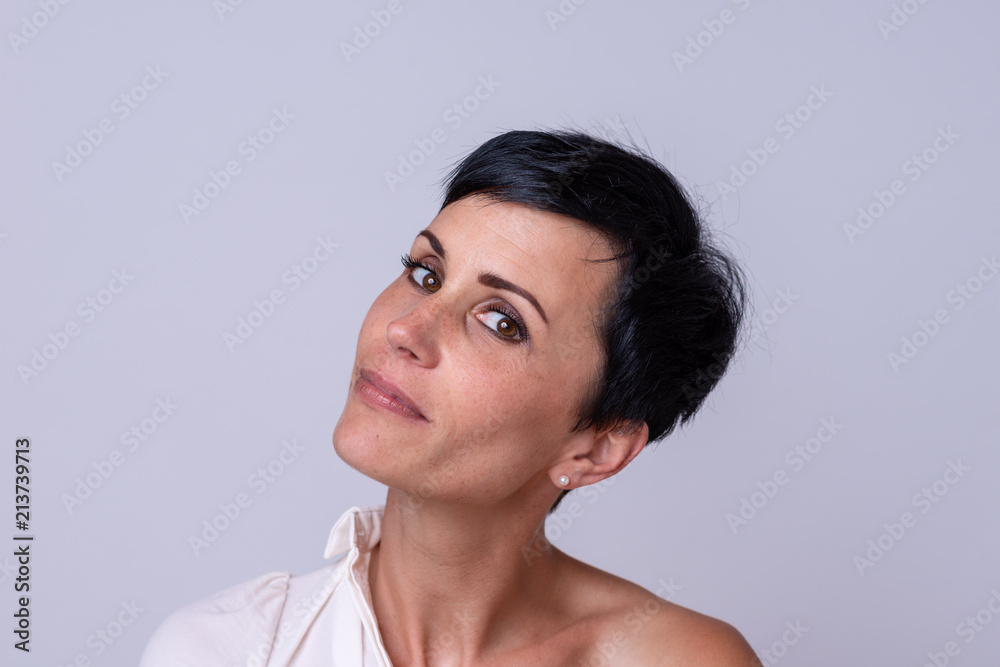 Smiling sexy woman flirting with the camera Smiling sexy woman flirting with the camera