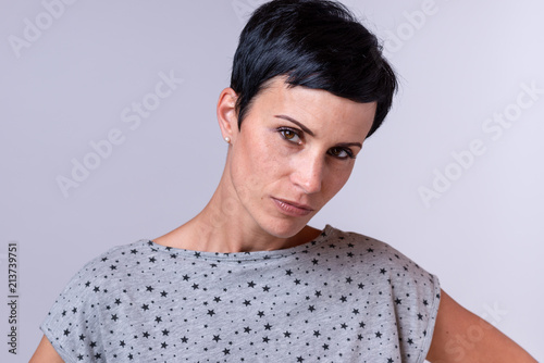 Attractive trendy woman with short dark hair