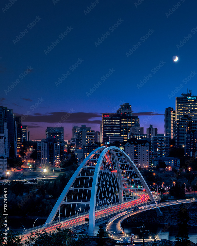 Light trails as traffic goes across the new bridge during blue hour in Edmonton (YEG), Alberta , Canada.