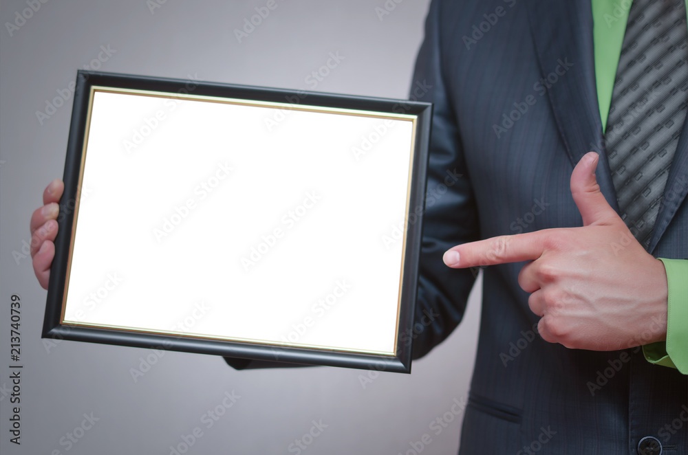 Blank diploma or certificate mock up in businessman hand. Empty photo frame border with copy space. Blank diploma or certificate mock up in businessman hand. Empty photo frame border with copy space.