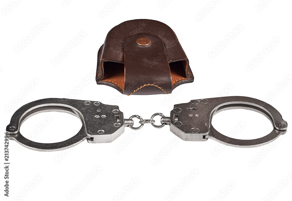 Obraz premium real police handcuffs with case, isolated on white background