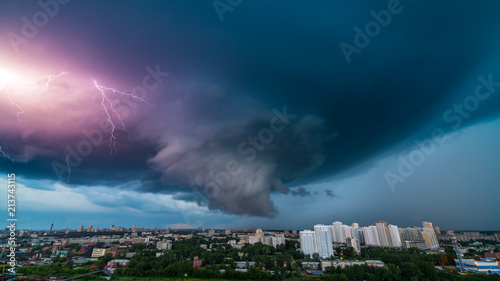 Thunderstorm in the city downtown at summer evening © Vasily