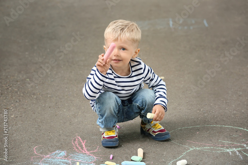 Cute little boy drawing wit...