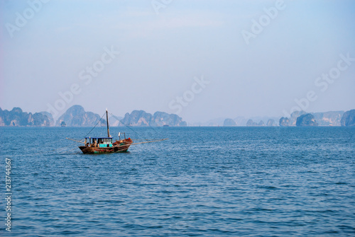 A small fishing boat in Halong bay. Vietnam