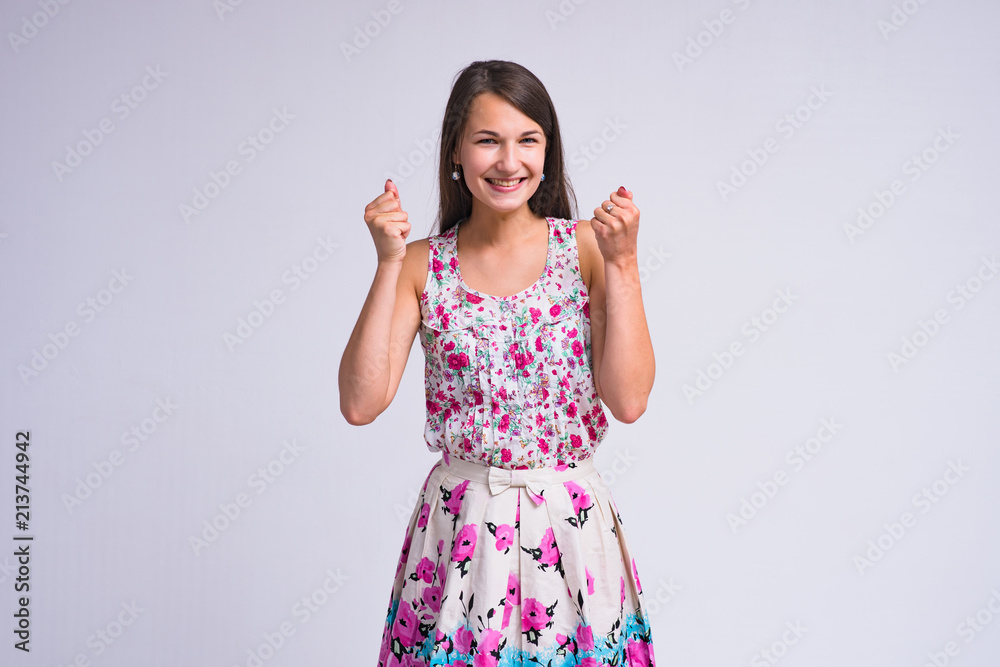 beautiful brunette girl on white background in different poses showing different emotions of surprise and happiness beautiful brunette girl on white background in different poses showing different emotions of surprise and happiness