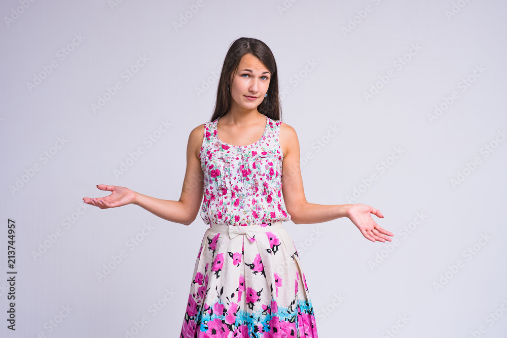 beautiful brunette girl on a white background in different poses showing different emotions of surprise beautiful brunette girl on a white background in different poses showing different emotions of surprise