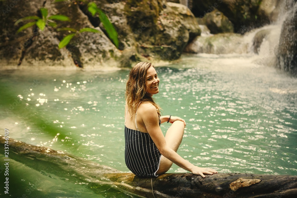 Fototapeta premium Beautiful woman in a natural pond