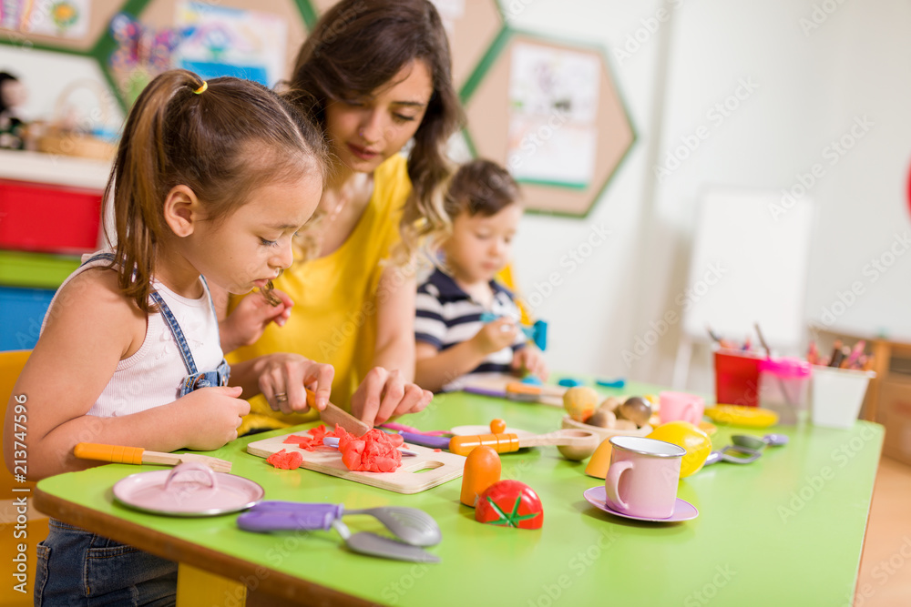 Childs are playing with play clay in classroom Childs are playing with play clay in classroom