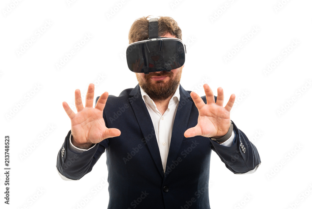 Business man wearing vr goggles doing hands gesture. Business man wearing vr goggles doing hands gesture.