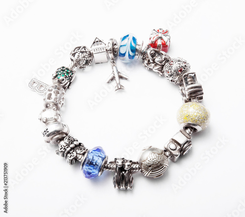 silver bracelet with charms on grey background
