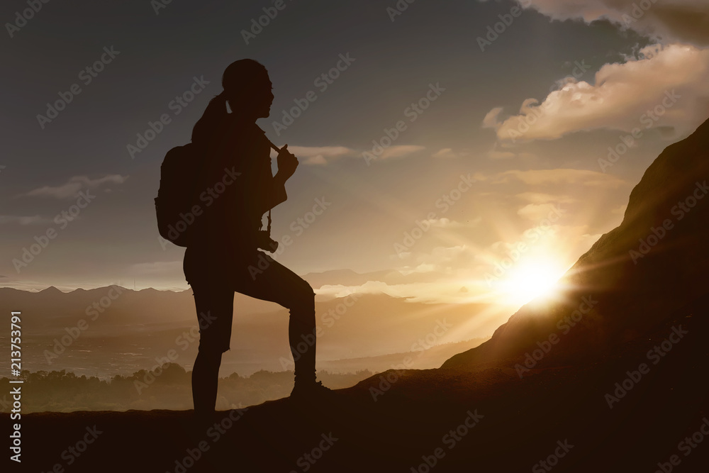 Silhouette of traveler woman hiking the mountain Silhouette of traveler woman hiking the mountain