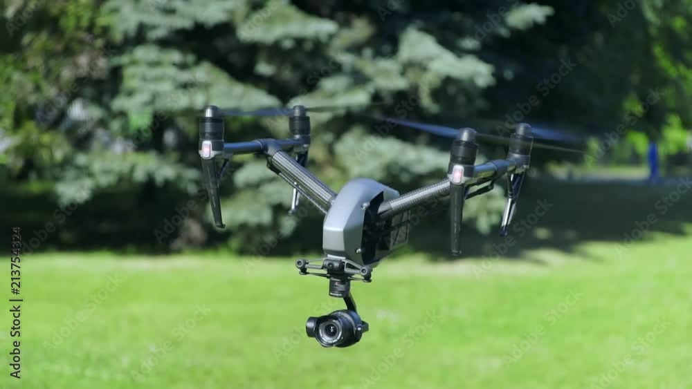 Drone with Camera on Gimbal flying in the Sky Drone with Camera on Gimbal flying in the Sky
