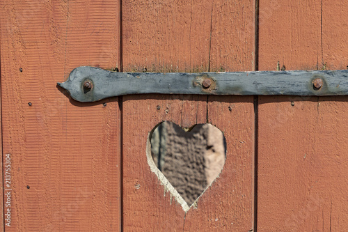 heart in a wooden door as symbol