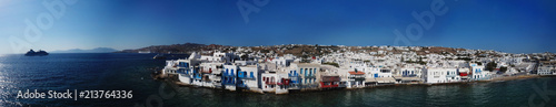 Aerial ultra wide panoramic drone view of iconic chora of Mykonos island featuring picturesque little Venice, Cyclades, Aegean, Greece © aerial-drone