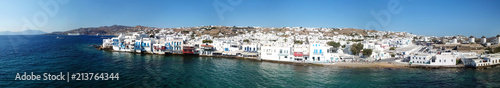 Fototapeta Naklejka Na Ścianę i Meble -  Aerial ultra wide panoramic drone view of iconic chora of Mykonos island featuring picturesque little Venice, Cyclades, Aegean, Greece