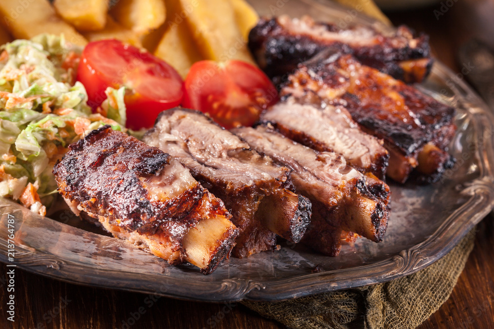 Spicy barbecued pork ribs with french fries