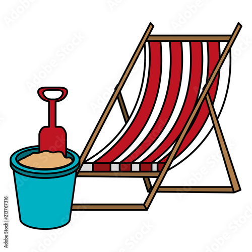 wooden beach chair and sand bucket