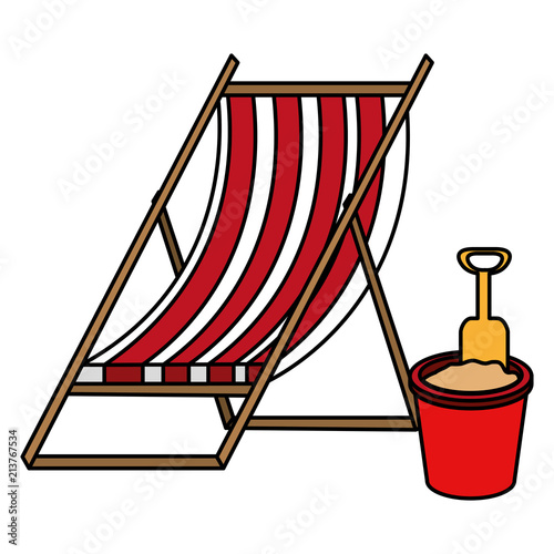 wooden beach chair and sand bucket