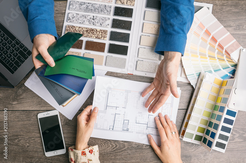communication designer and customer. choice of colors and materials. selection of design elements for new interior repair. Work of designer and client. Working space top view