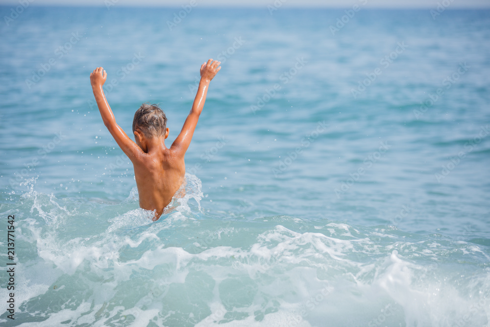Happy child on beach. Summer vacation concept Happy child on beach. Summer vacation concept