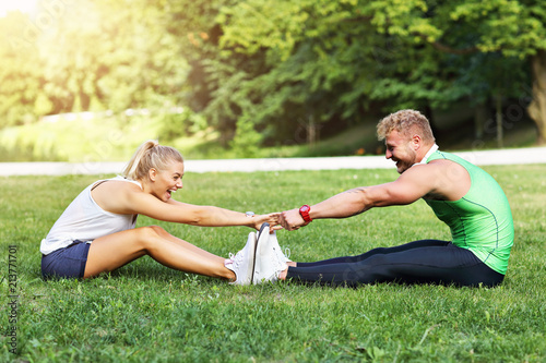 Young couple working out in park