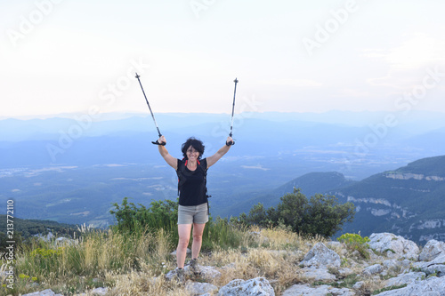 portrait of a female hiker who has reached the top