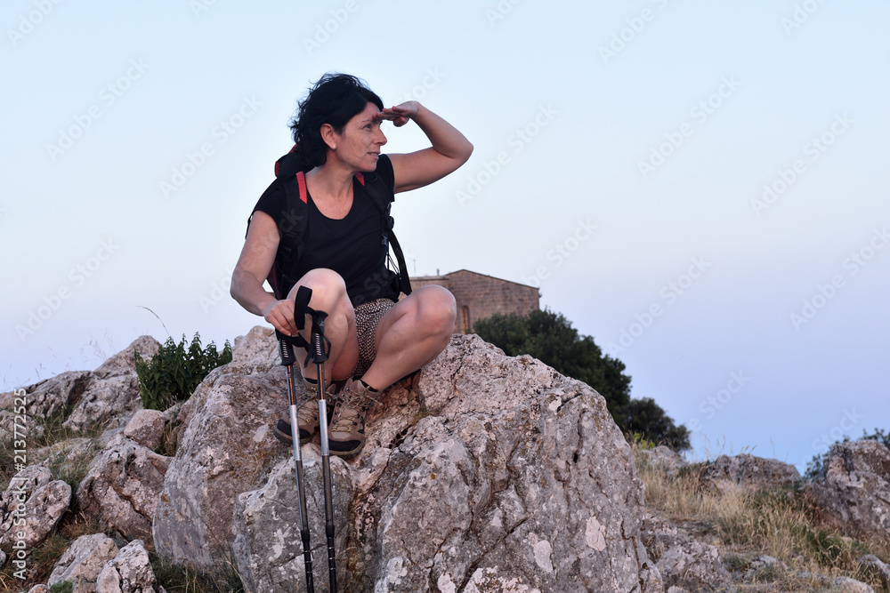 portrait of a female hiker who has reached the top