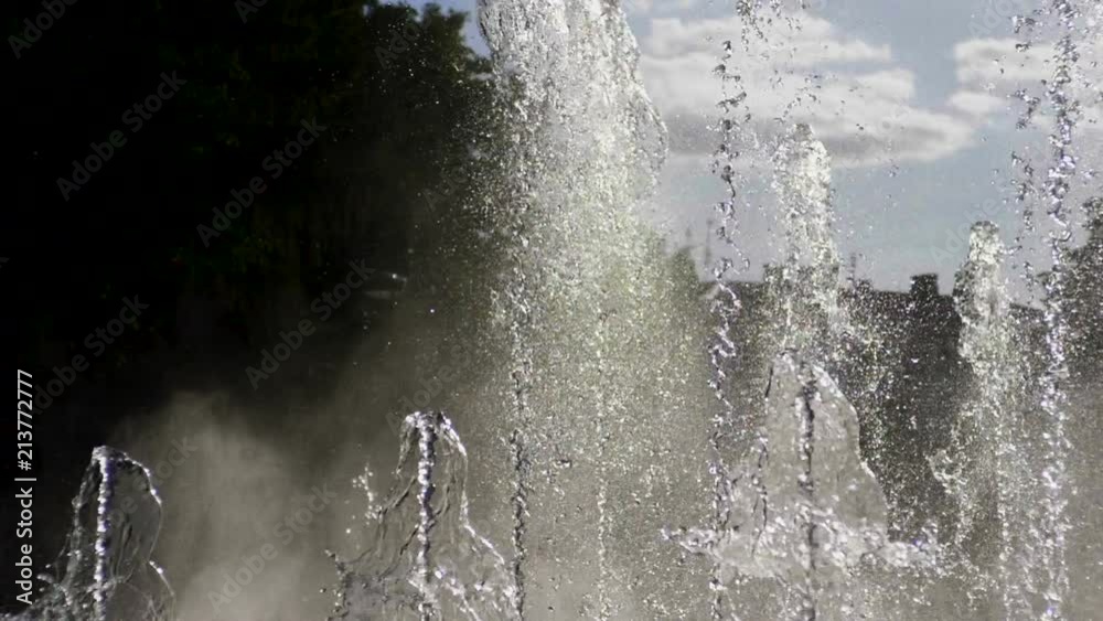 Close-up shot of water drops of fountain in the summer park. Slow motion. HD Close-up shot of water drops of fountain in the summer park. Slow motion. HD