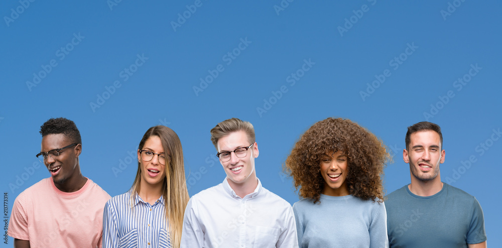 Composition of group of friends over blue blackground winking looking at the camera with sexy expression, cheerful and happy face. Composition of group of friends over blue blackground winking looking at the camera with sexy expression, cheerful and happy face.