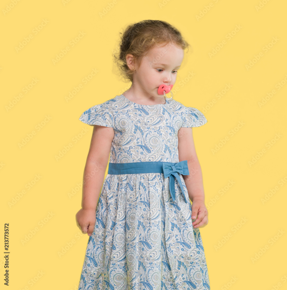 Beautiful blonde toddler gesturing