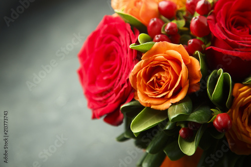 Winter or autumn bouquet with roses