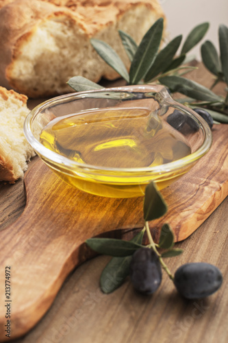 olive oil on rustic background.