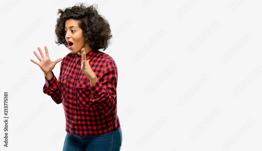 Beautiful arab woman stressful keeping hands on head, terrified in panic, shouting Beautiful arab woman stressful keeping hands on head, terrified in panic, shouting