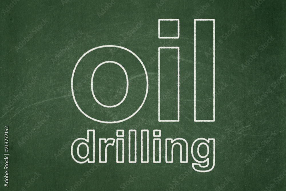Obraz premium Industry concept: text Oil Drilling on Green chalkboard background