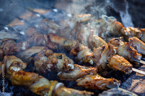 The process of cooking chicken barbecue. Picnic.