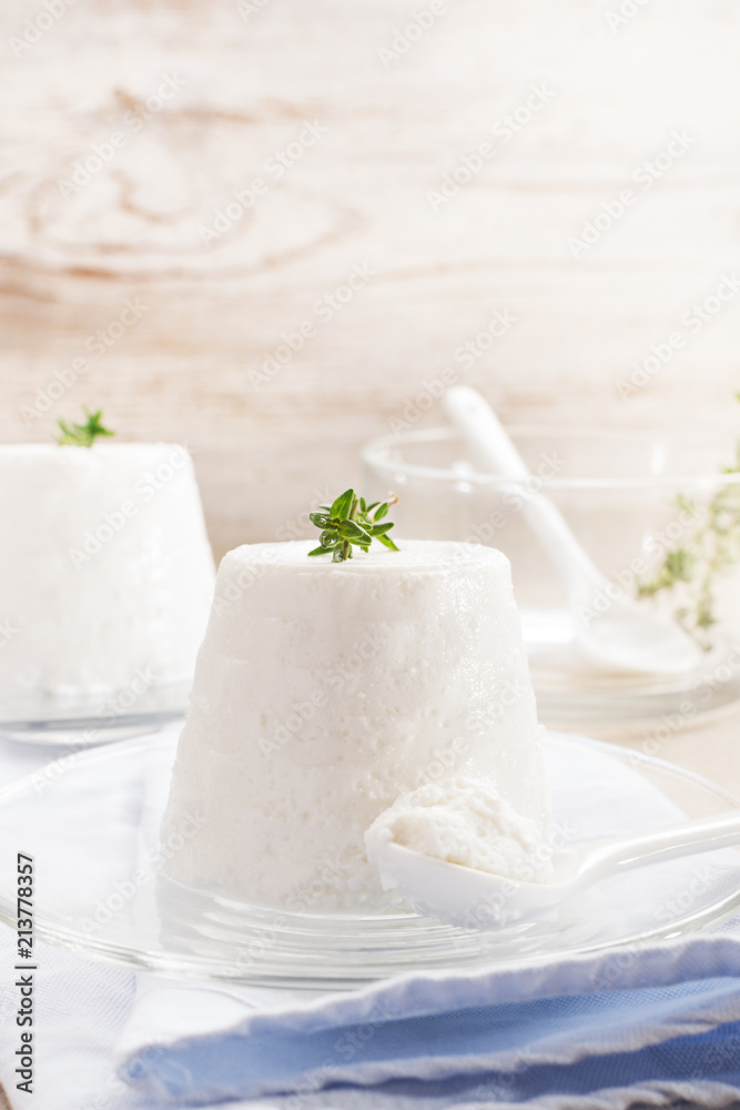 ricotta cheese on rustic background.