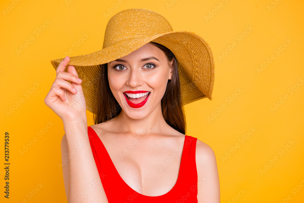 Closeup photo portrait of cheerful cool joyful excited amazed astonished beautiful girl with stylish make-up touching wide brim on trendy hat laughing at camera isolated vivid background Closeup photo portrait of cheerful cool joyful excited amazed astonished beautiful girl with stylish make-up touching wide brim on trendy hat laughing at camera isolated vivid background