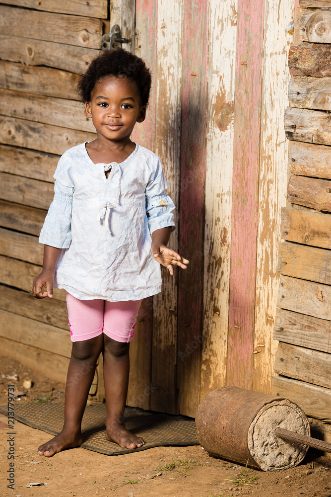 Little girl infront of her house Little girl infront of her house