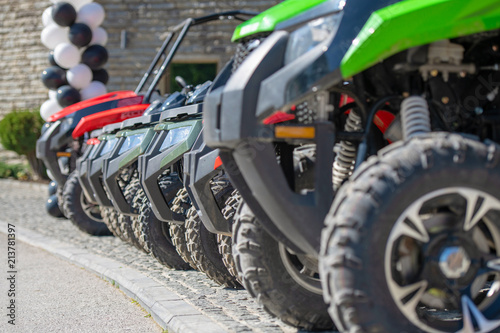 parked in a row several atv quad bikes extreme outdoor adventure concept