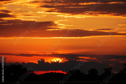 Dramatic sky with storm clouds in sunset time. Mulicolored background