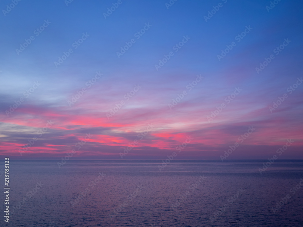 Pink and purple sky above sea
