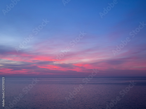 Pink and purple sky above sea